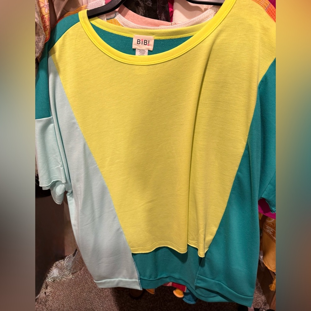 Asymmetrical top. Size medium. NWOT.